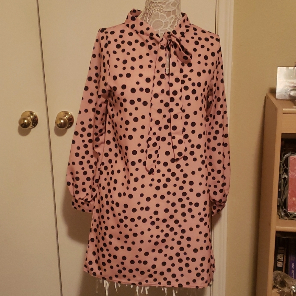 Women's peach and black polka dot dress.